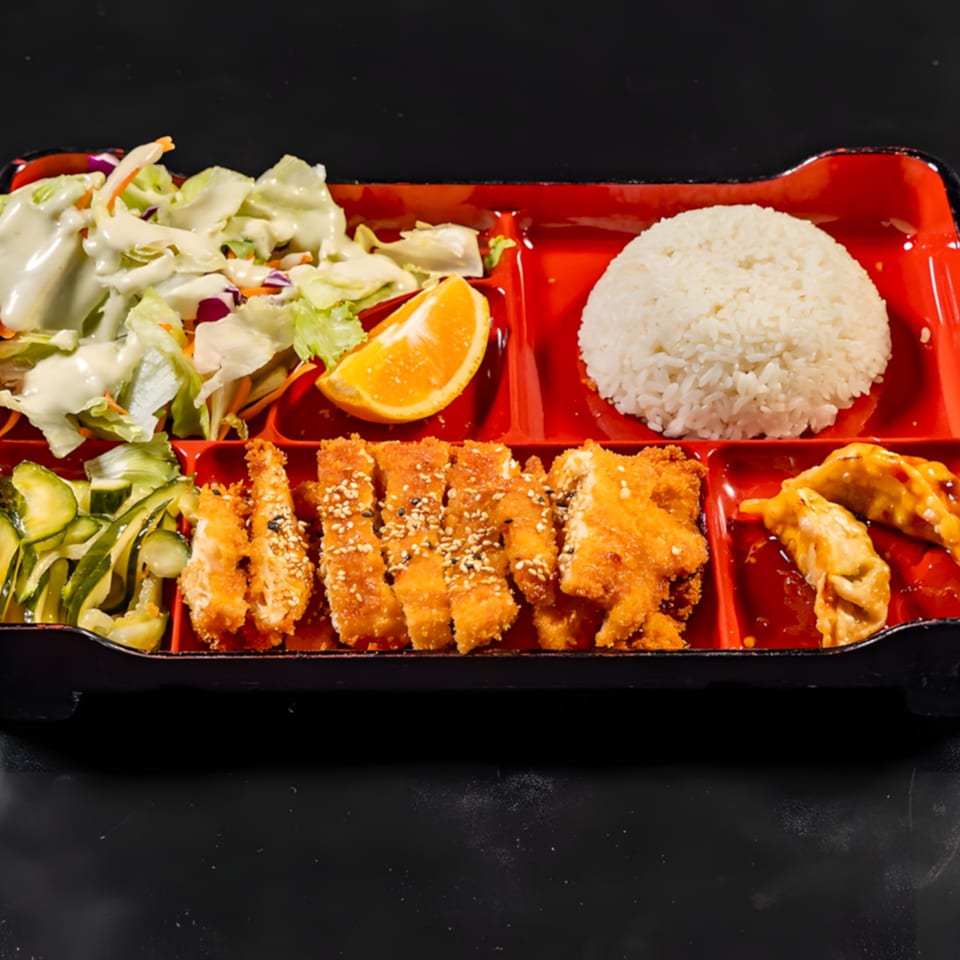 Express Sushi & Teriyaki bento box with fried chicken, rice, salad, cucumber salad, orange slice, and dumplings.